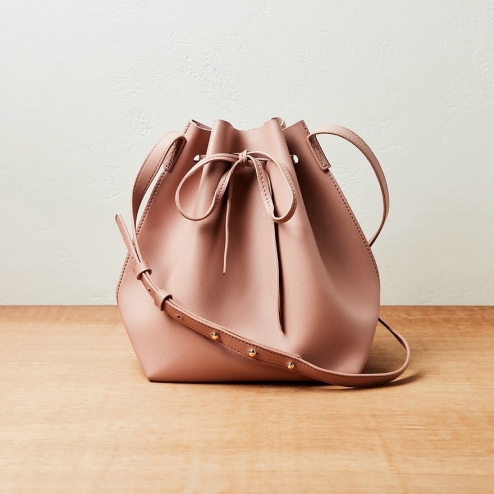 KAYLA + AVA. Vegan leather bow tie bucket bag. New. Dusty rose.